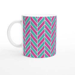 Pink and aqua ceramic mug featuring a retro geometric herringbone pattern with glossy finish.