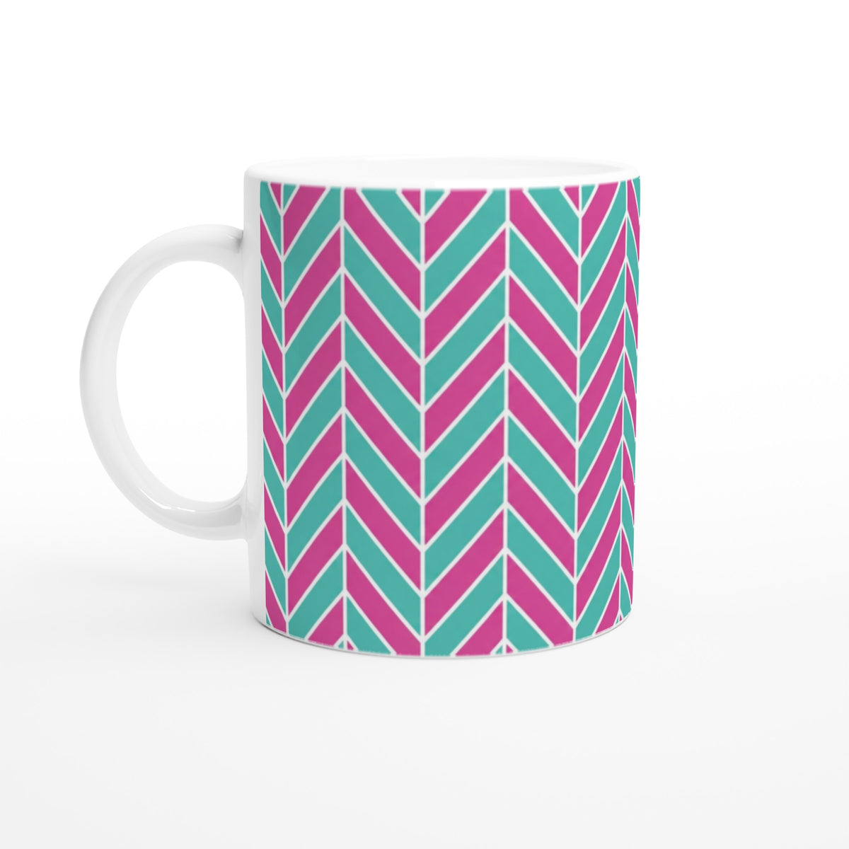 Pink and aqua ceramic mug featuring a retro geometric herringbone pattern with glossy finish.