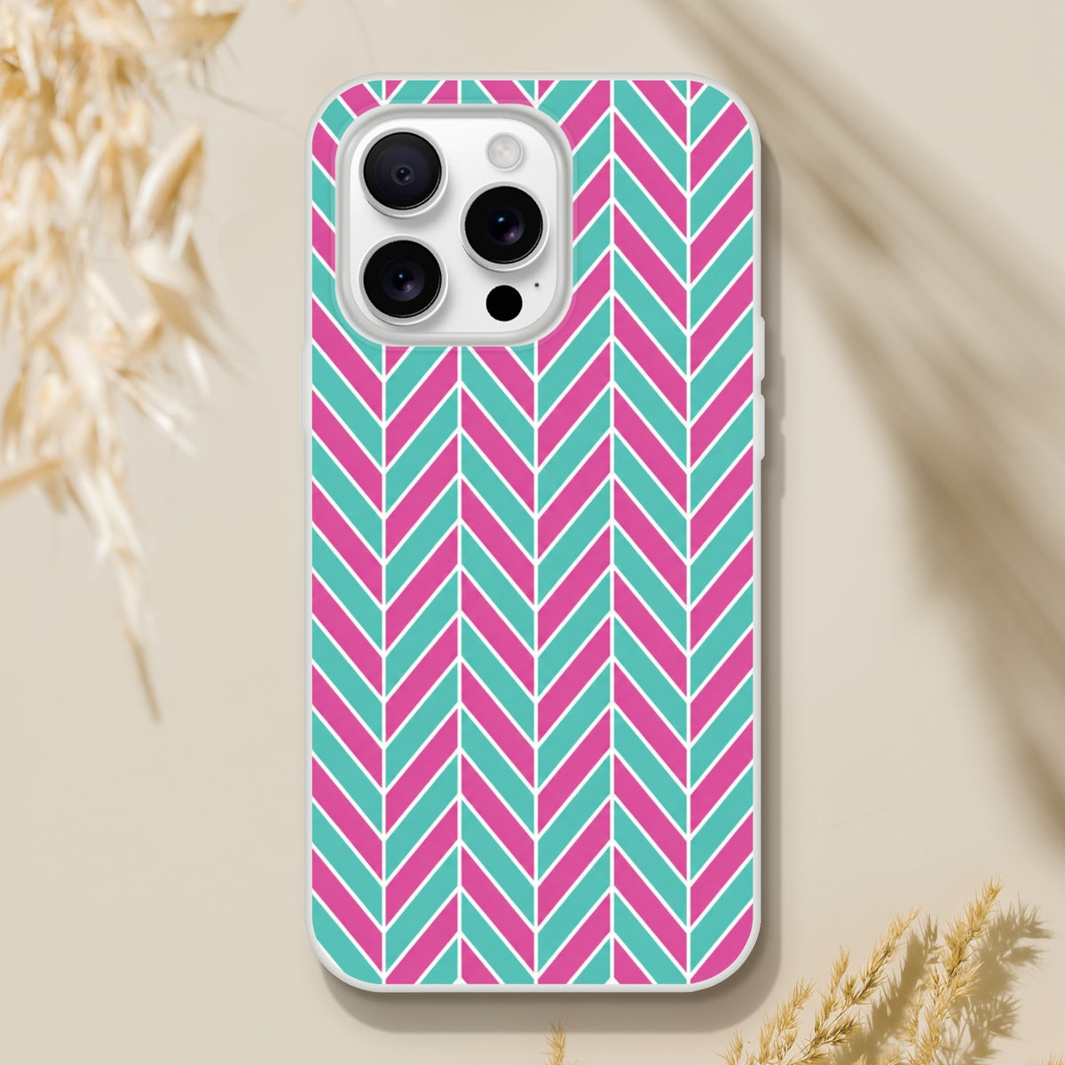 Pink and turquoise herringbone pattern iPhone case with geometric chevron design for models 13-16.