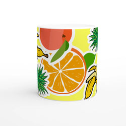 Vibrant ceramic mug featuring banana, pineapple, and orange slice illustrations on a yellow background.
