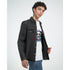Male model in white Panda DJ graphic tee with panda art, layered under a black denim jacket.