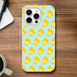 Pastel blue iPhone case featuring a yellow lemon pattern. Cute summer fruit TPU phone cover for iPhone 13-16, offering shock-absorbing protection on a wooden surface.