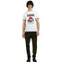 Male model wearing white Japanese JDM graphic T-shirt with vintage car print.