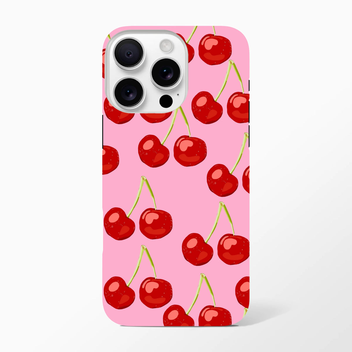 Pink iPhone case featuring a vibrant red cherry pattern with green stems on a bright pink background.