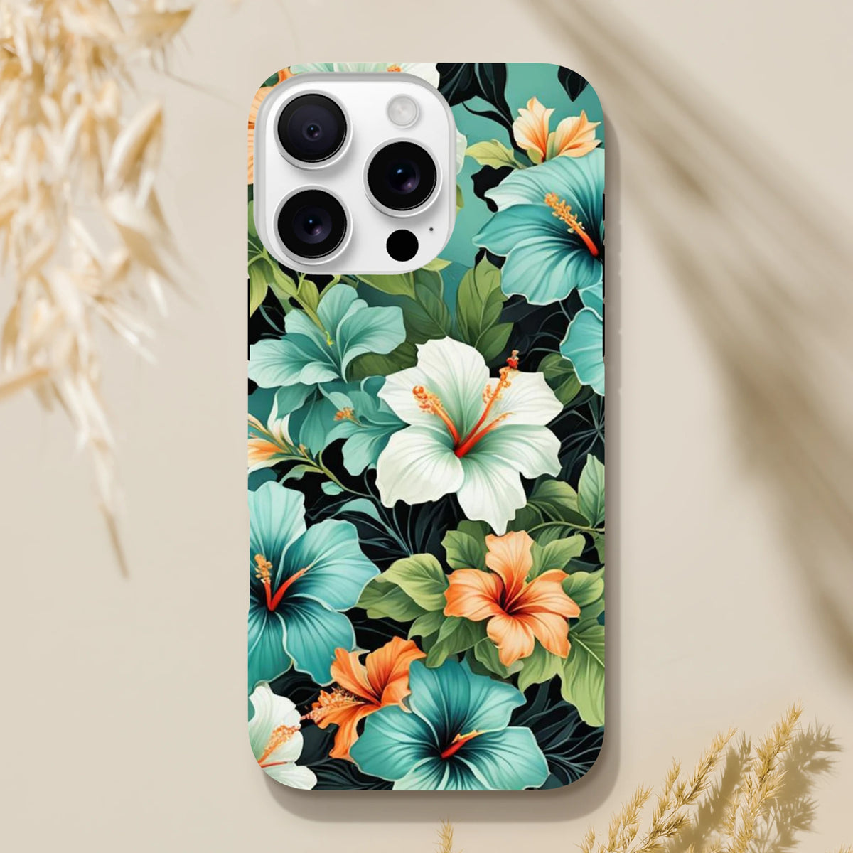 Tropical floral iPhone case featuring vibrant teal and orange hibiscus flowers with lush green leaves on a dark background.