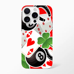 Tough iPhone case featuring lucky charm graphics including an 8-ball, ace of hearts, four-leaf clover, and horseshoe on a red background.