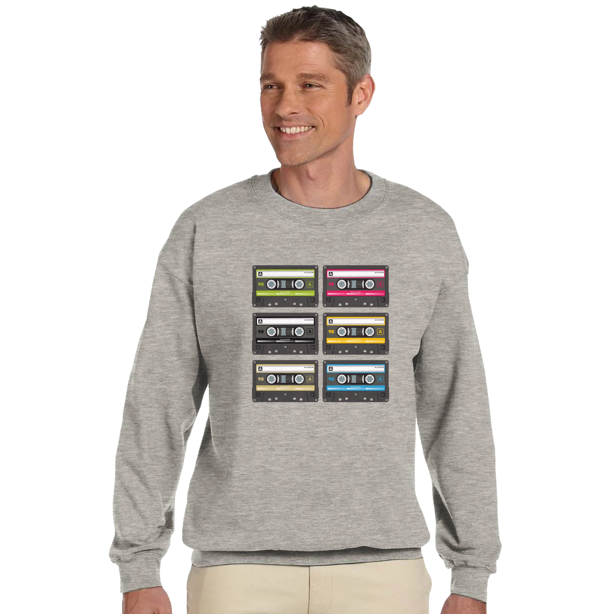 Gray men's sweatshirt featuring a grid of six colorful retro cassette tapes with 90s vintage music graphic design.