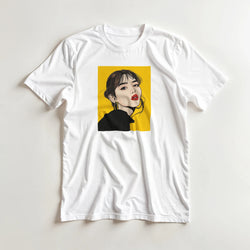 White t-shirt featuring a bold Pop Art graphic of a woman with red lips and gold hoops against a yellow background.