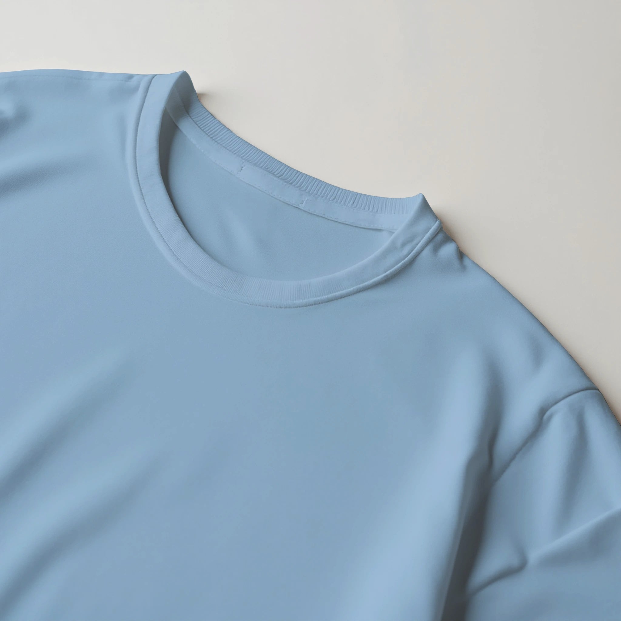 Close-up of a light-blue Japanese men's crew-neck T-shirt in a soft cotton blend.