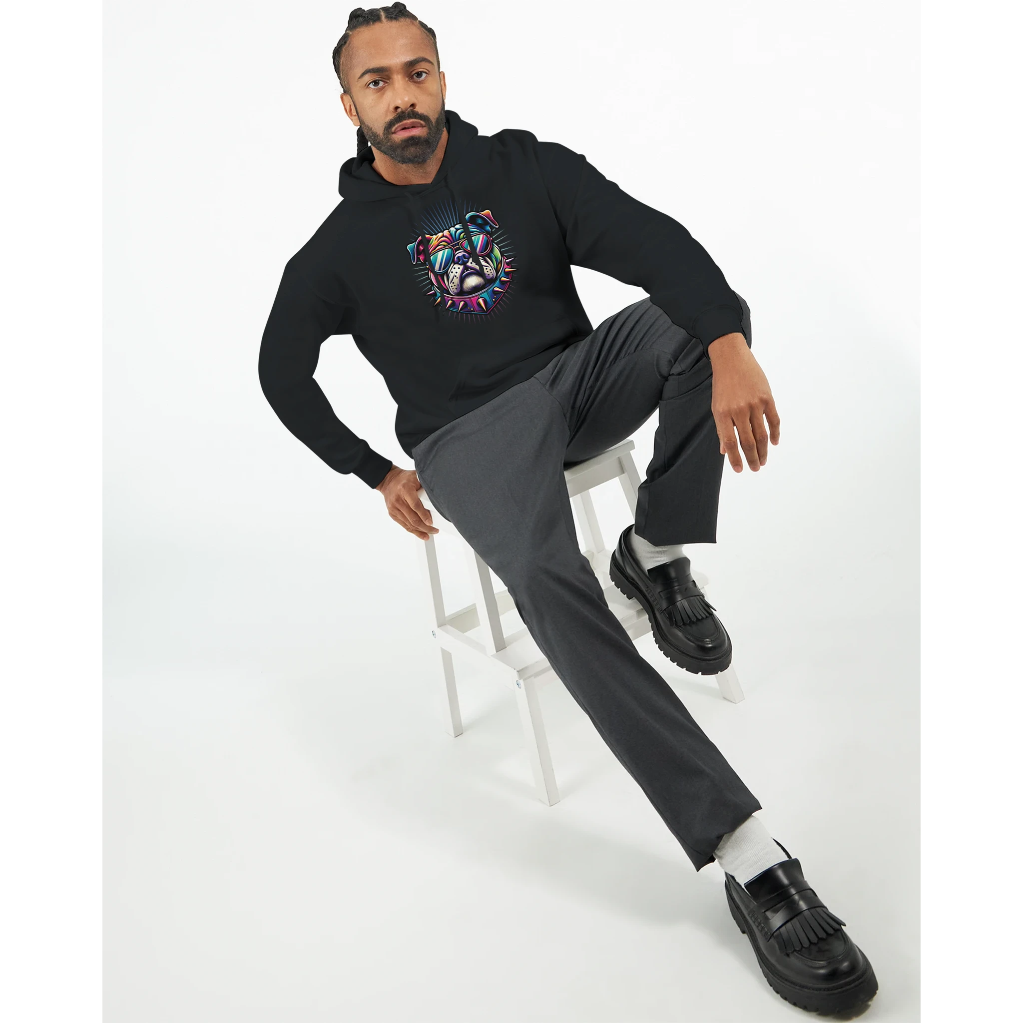Man wearing black British Bulldog graphic hoodie with a colorful bulldog design and front pouch pocket.