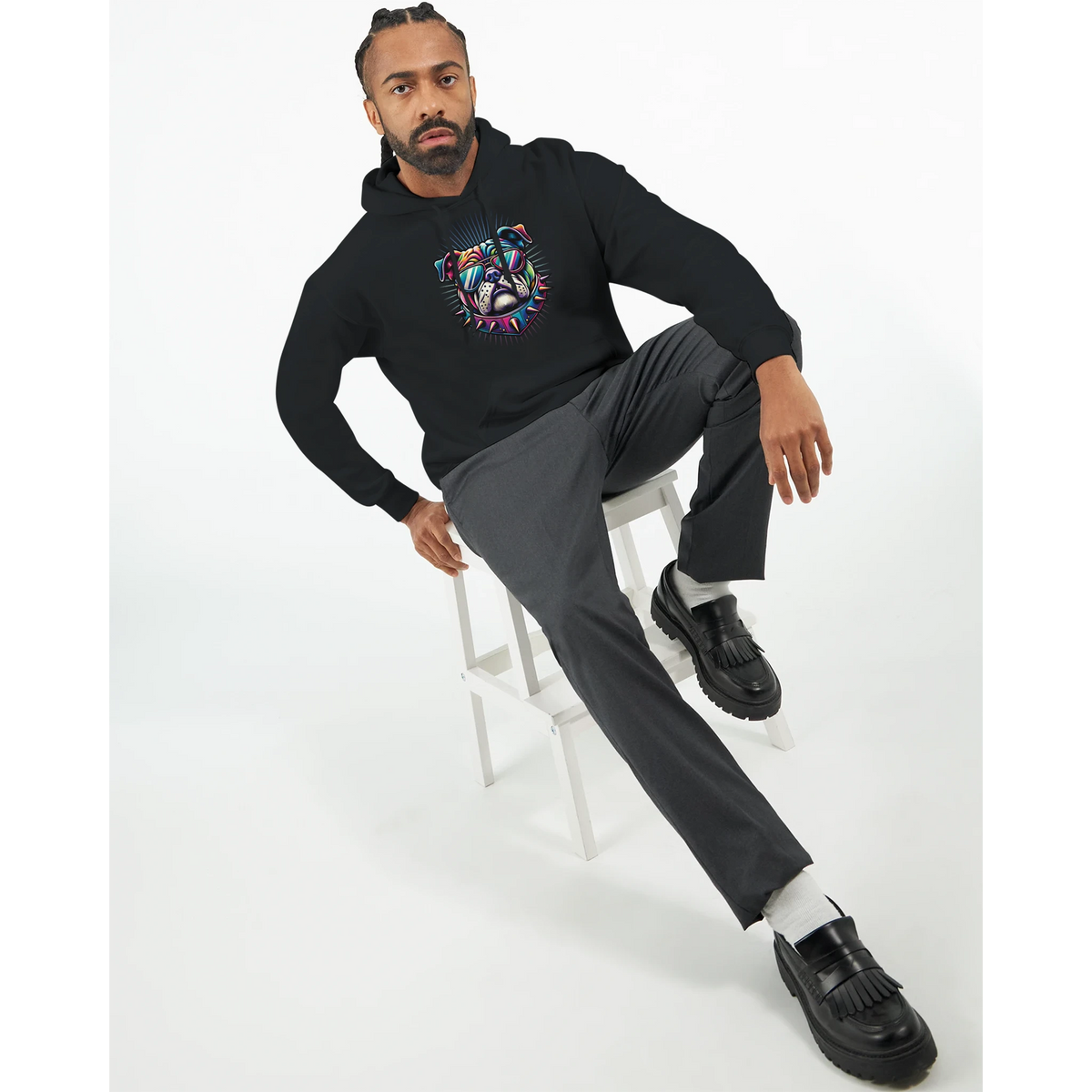 Man wearing black British Bulldog graphic hoodie with a colorful bulldog design and front pouch pocket.