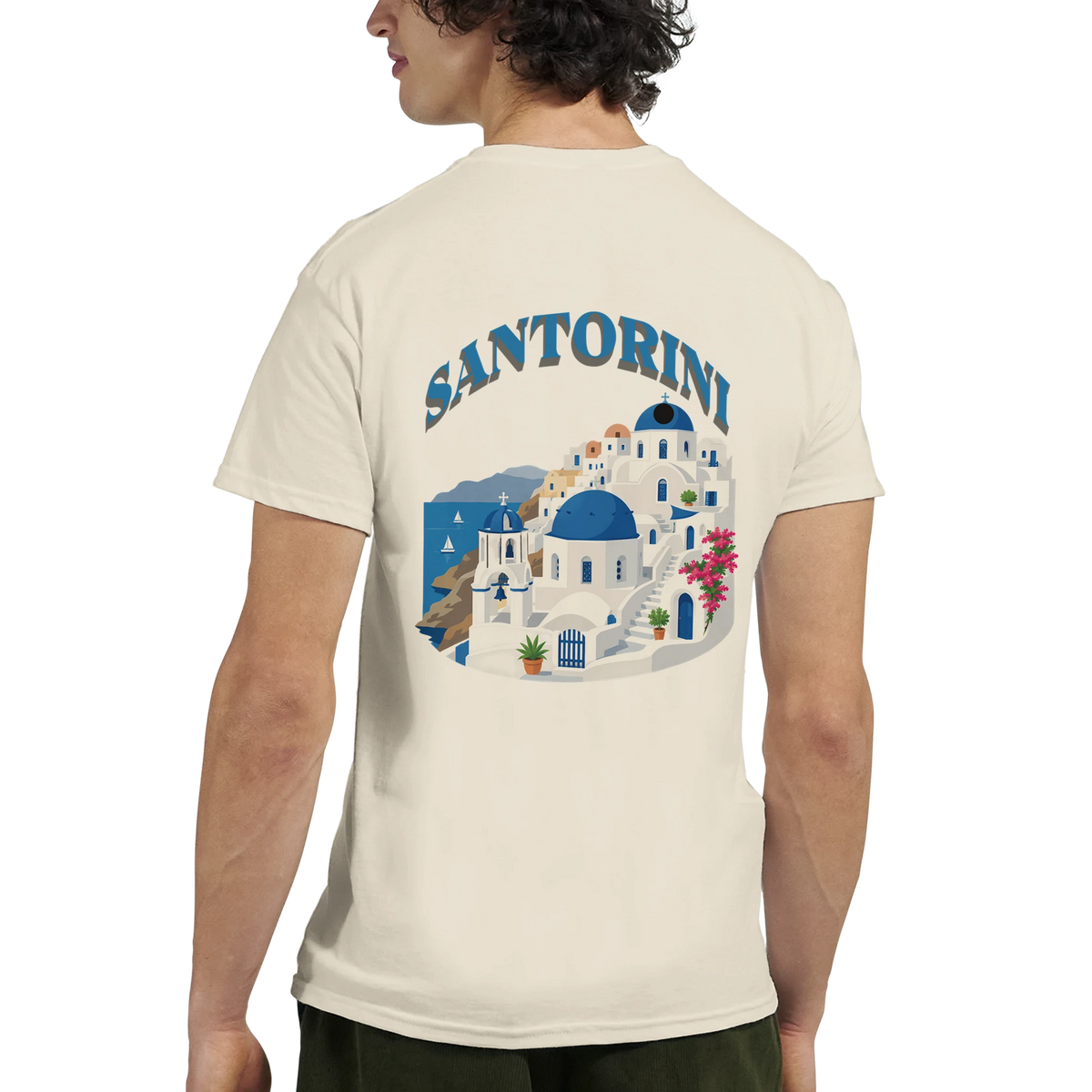Back view of a person wearing a Santorini Greece graphic tee with blue-domed Cycladic buildings.