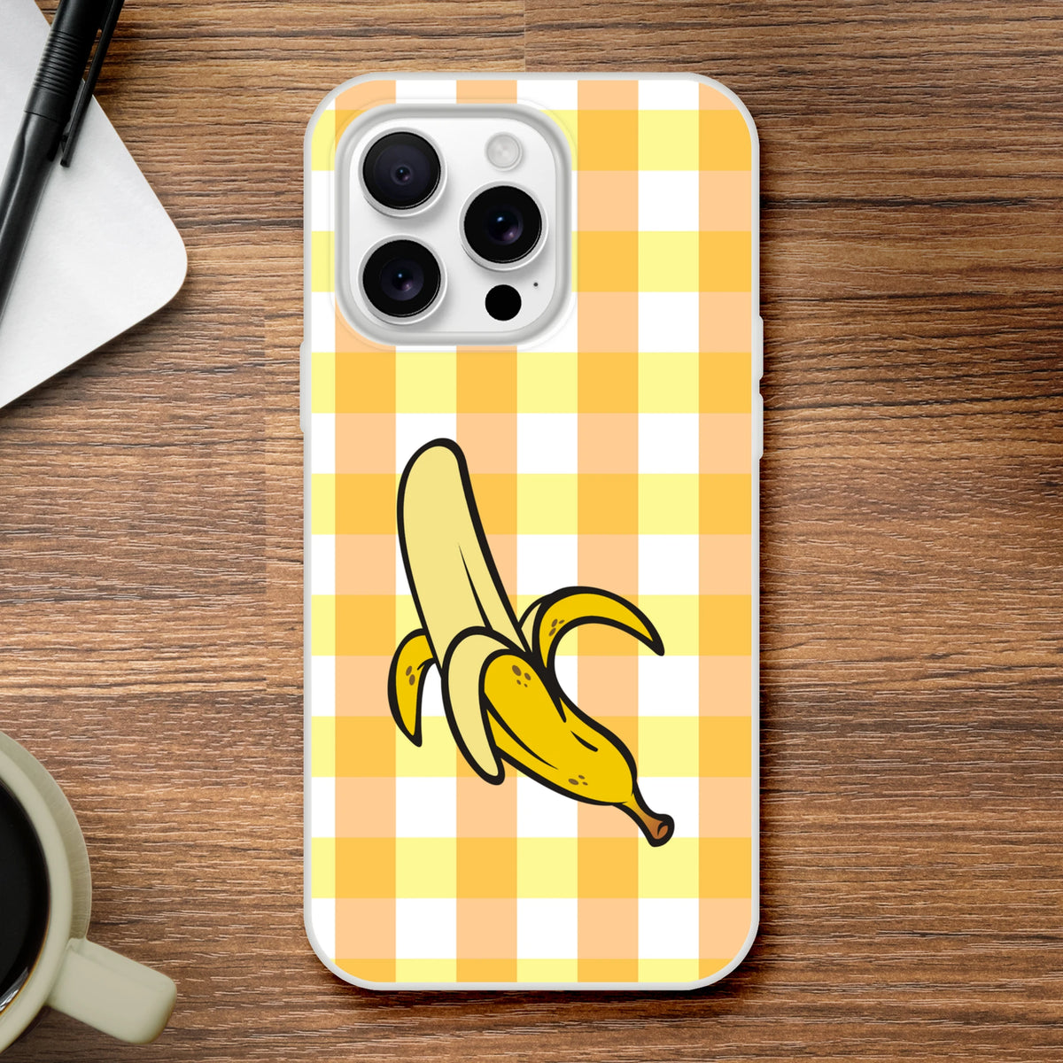 Yellow banana-gingham iPhone case (13–16) with banana graphic, bold streetwear-inspired phone cover.