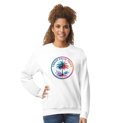 Woman wearing a white Urban Palm Trees sweatshirt with a circular tropical palm graphic.