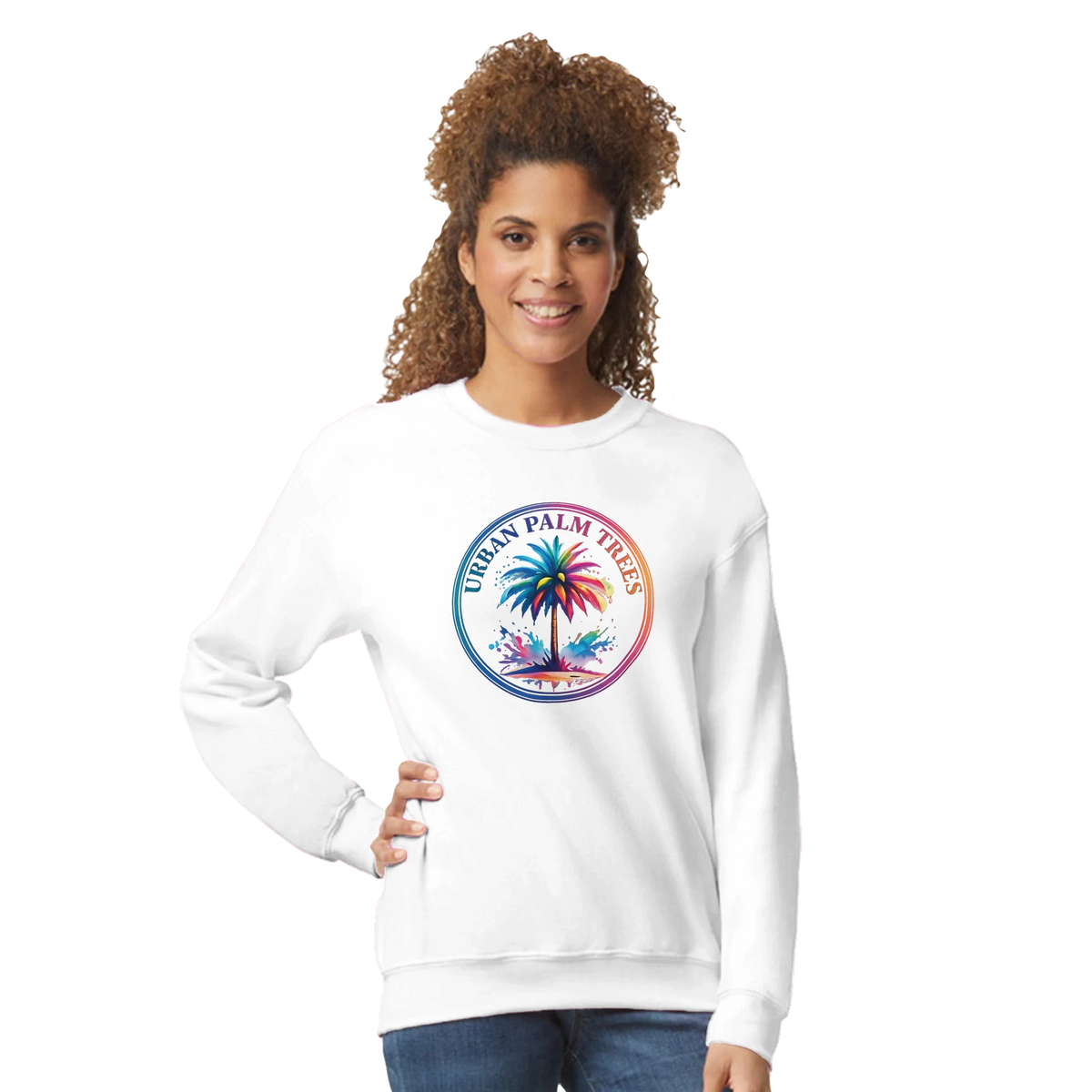 Woman wearing a white Urban Palm Trees sweatshirt with a circular tropical palm graphic.