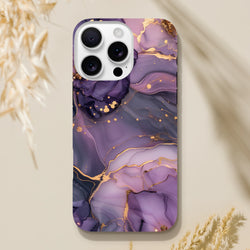 Luxury purple and gold marble iPhone case with abstract gold veins. Tough protective cover featuring bold fluid art design for stylish streetwear aesthetics.