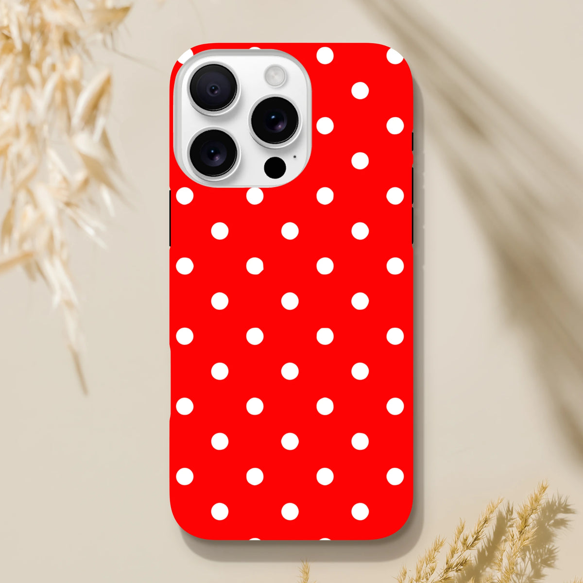 Red and white polka dot tough iPhone case with playful vintage styling. Dual-layer TPU shell protects iPhones 13-16 from drops and scuffs.