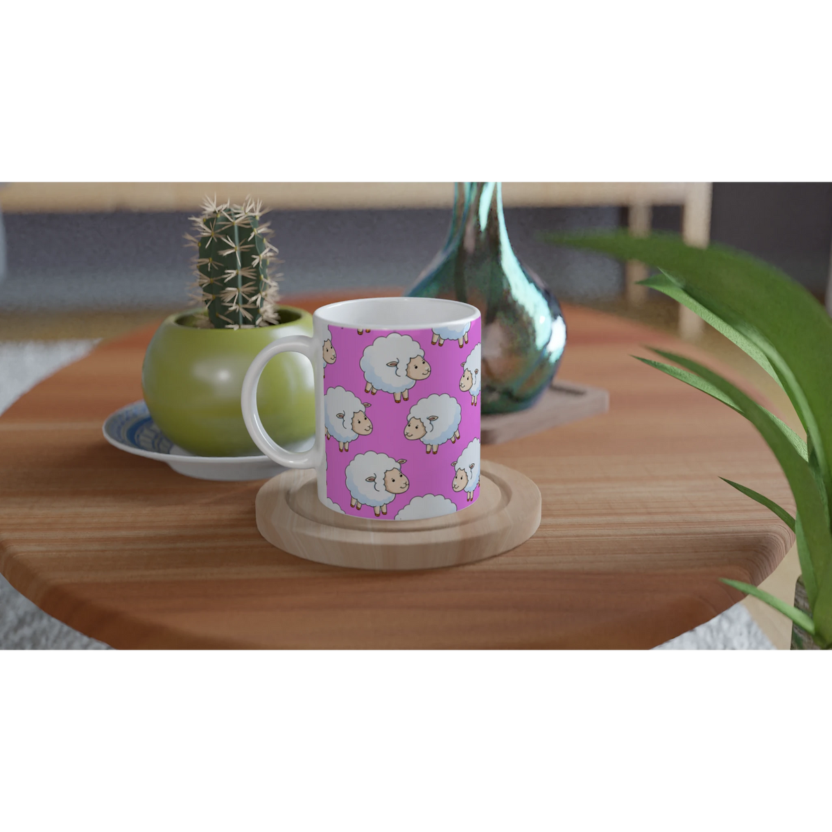Pink aesthetic sheep ceramic mug with lamb illustrations on a wooden table beside a cactus.