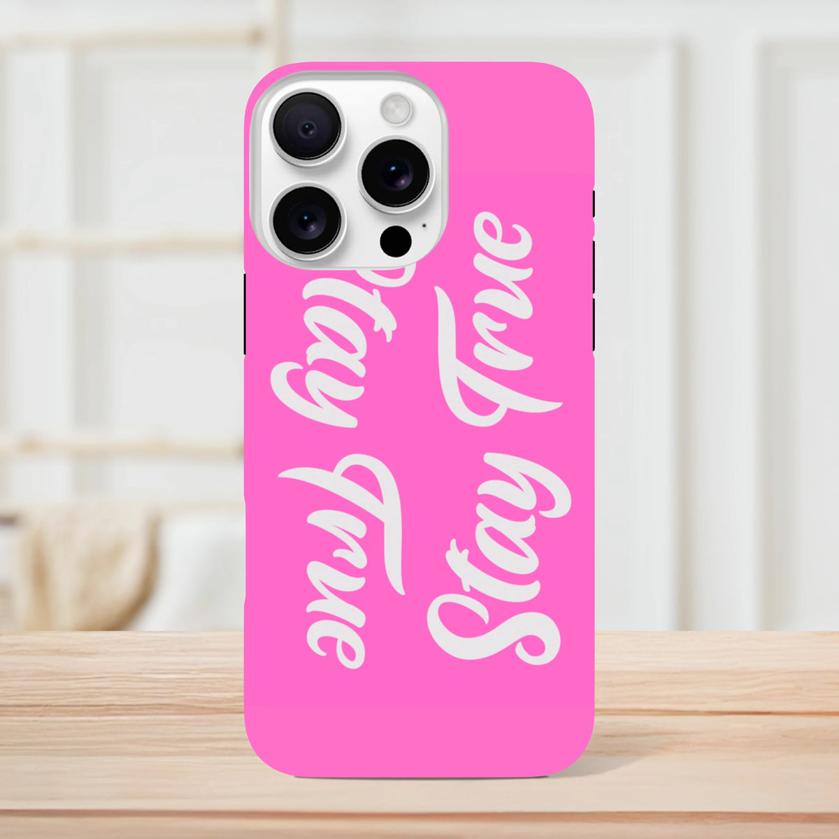 Pink Tough iPhone case featuring white "Stay True" cursive quotes for models 13 through 16.