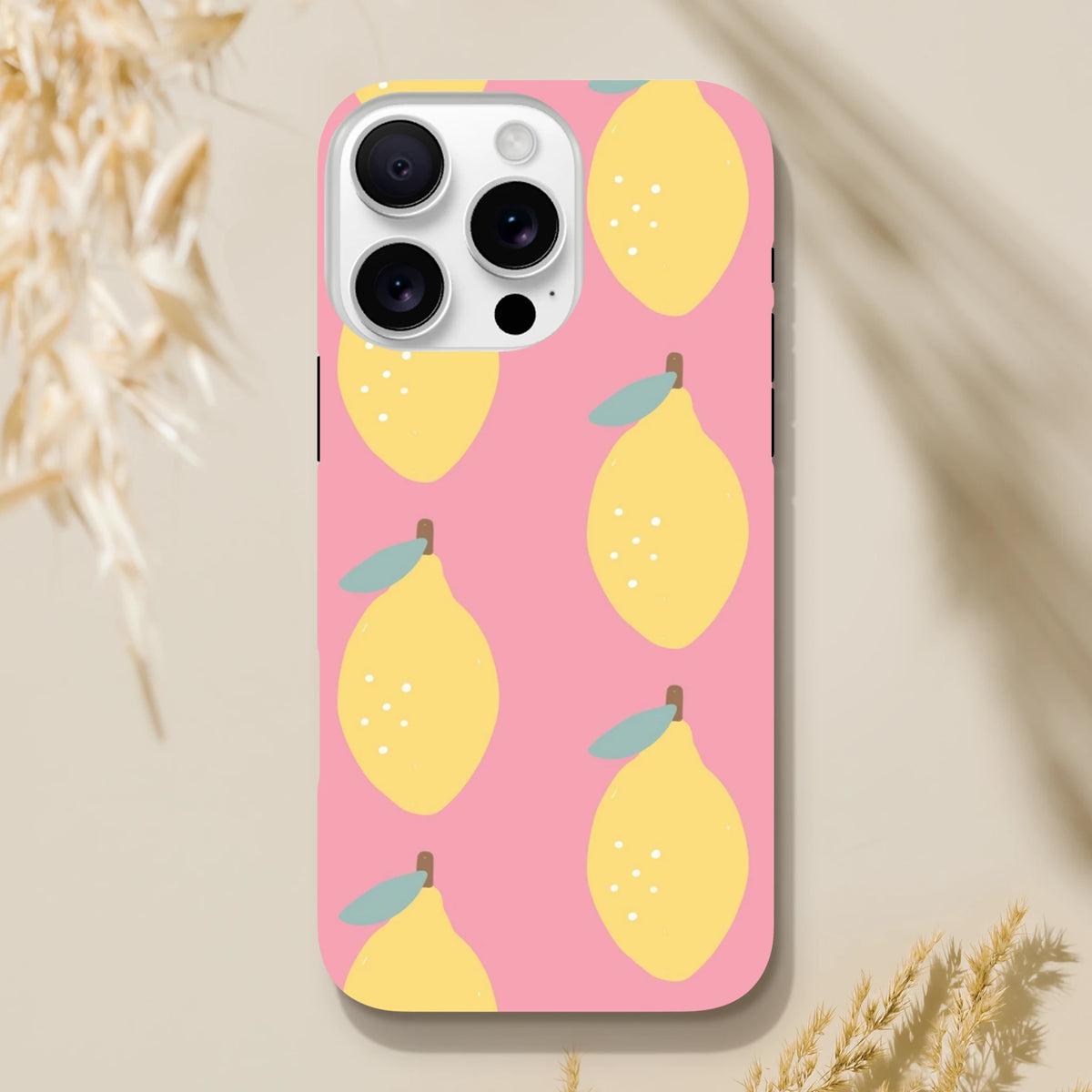 Pink lemon tough iPhone case featuring a cute yellow fruit pattern on a pink background, designed for street style protection.