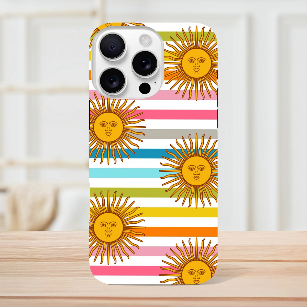 Retro iPhone case featuring celestial sun faces with rainbow stripes and tough protective design for daily transit use.
