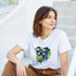 Woman wearing Chill Dog T-Shirt white graphic tee with a colorful dog in sunglasses licking a green popsicle.