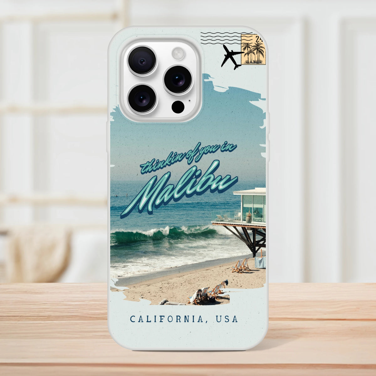 Vintage Malibu postcard iPhone case for iPhone 13-16 with beach scene, palm trees, and retro typography.
