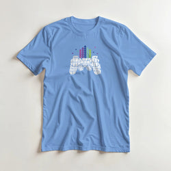 Light blue men's retro gamer graphic T-shirt with pixel-art controller and colorful arcade skyline.