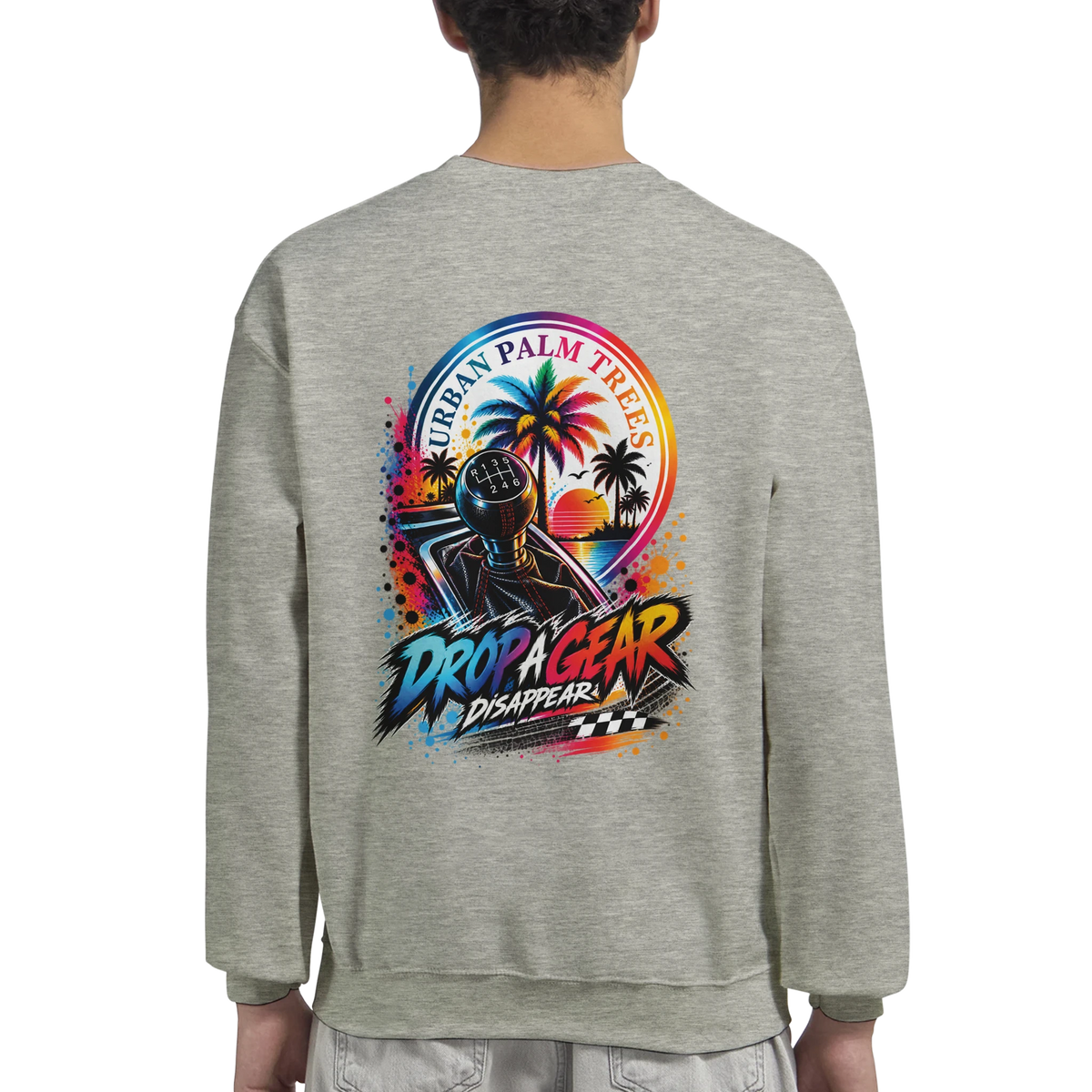 Grey sweatshirt featuring a colorful "Drop A Gear" back print with a manual shifter, palm trees, and sunset graphic.