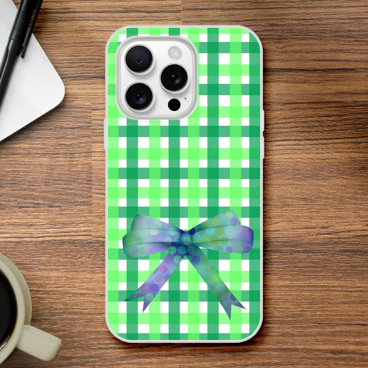 Green gingham bow iPhone case for 13–16 in a cute coquette aesthetic with frosty transparent TPU and printed bow.