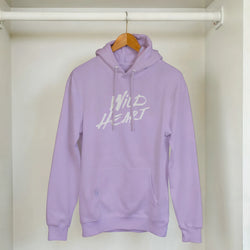 Cute Wild Heart Hoodie on a wooden hanger in a closet; lavender with white slogan.