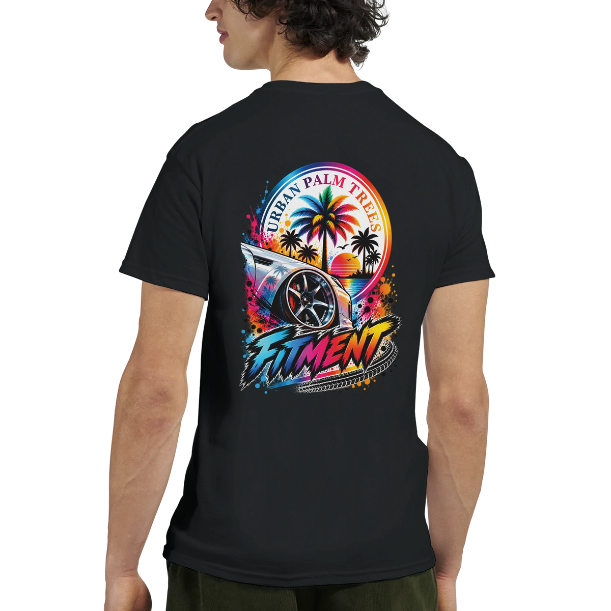 Black graphic tee featuring a lowered modified car, palm trees, sunset, and "FITMENT" text for petrolhead culture.