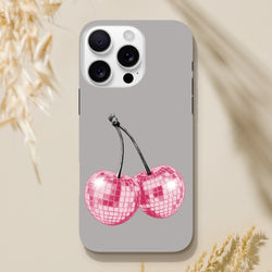 Gray iPhone case featuring pink disco ball cherry design, tough fruit phone cover for iPhone 13-16.