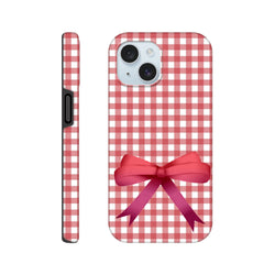 Red gingham iPhone case featuring a large red 3D bow. Cute coquette style tough cover with wraparound print for streetwear aesthetic.