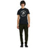 Man wearing black men's graphic T-shirt with skull and Ride or Die Motorcycle Club design.