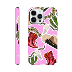 Pink western iPhone case featuring red cowboy boots, cactus, horseshoe, and longhorn skull desert designs for drop resistance.