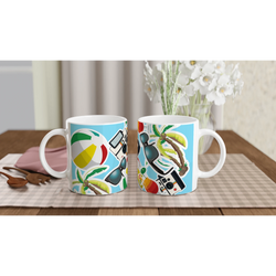 Summer Holiday ceramic mug featuring beach ball, palm tree, sunglasses, and camera print on blue background. Perfect for coffee or tea.