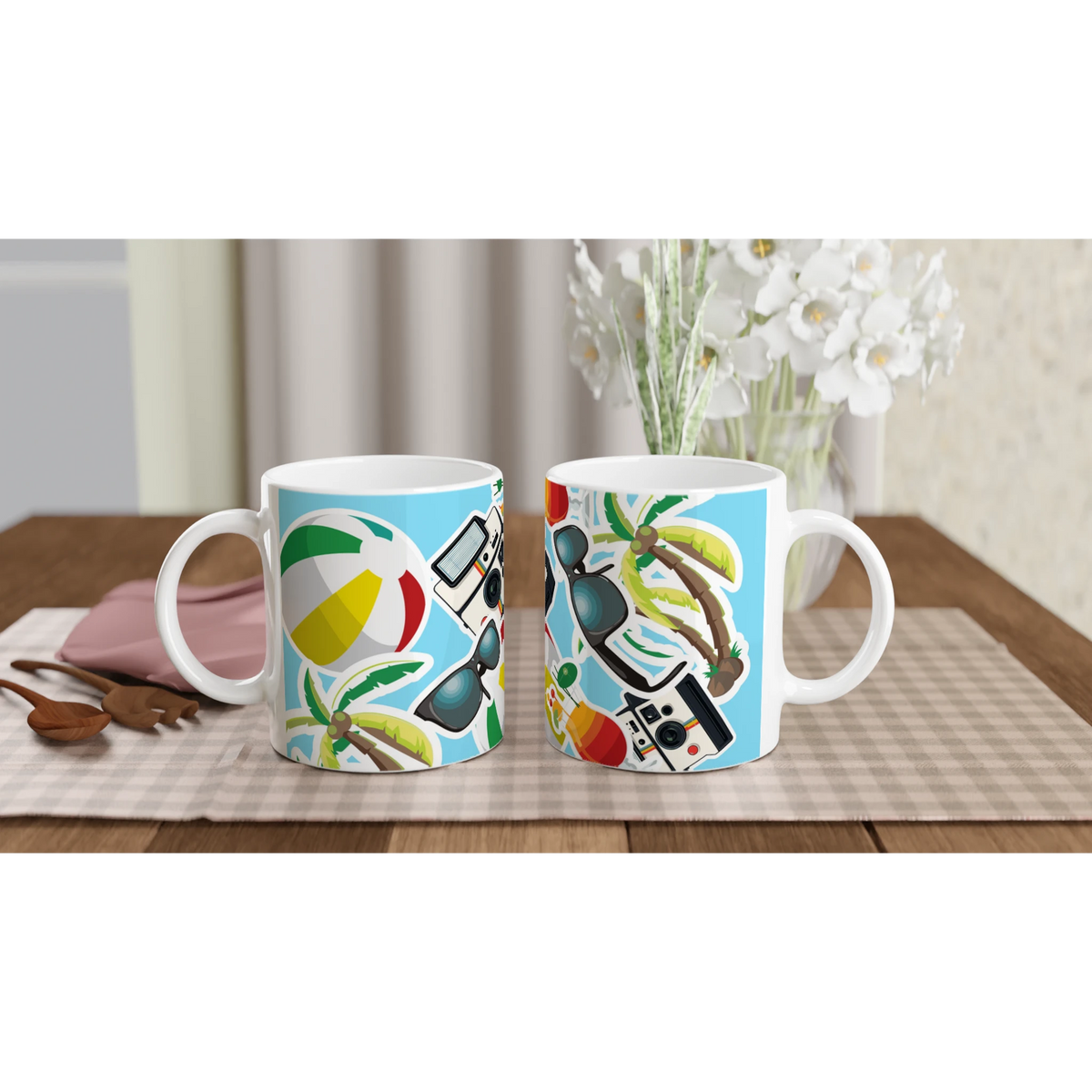 Summer Holiday ceramic mug featuring beach ball, palm tree, sunglasses, and camera print on blue background. Perfect for coffee or tea.