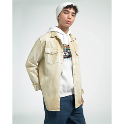 Male model in white teddy bear hoodie with colorful graphic, layered under beige denim jacket, casual streetwear.