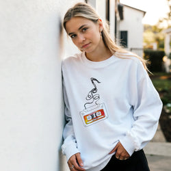 Woman wearing Retro Cassette Tape sweatshirt for Women with vintage cassette graphic, 90s nostalgia streetwear.