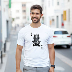 Man wearing white gothic streetwear tee featuring a crowned King Skull Poker graphic design.