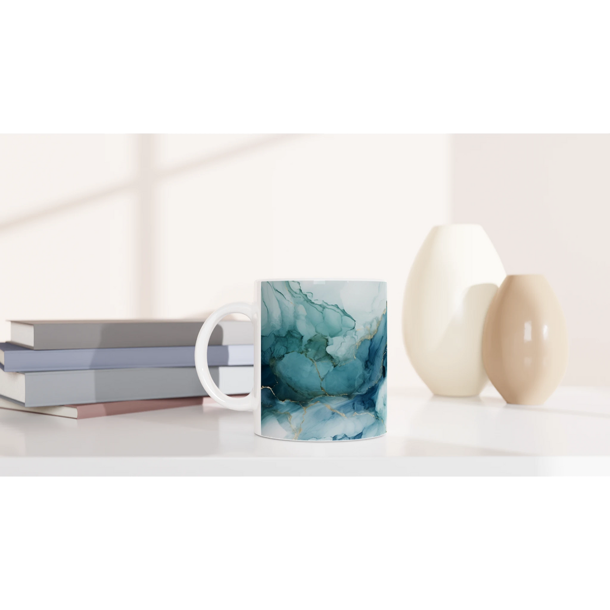 Blue Marble Mug with ocean-abstract glaze on ceramic coffee cup beside stacked books.