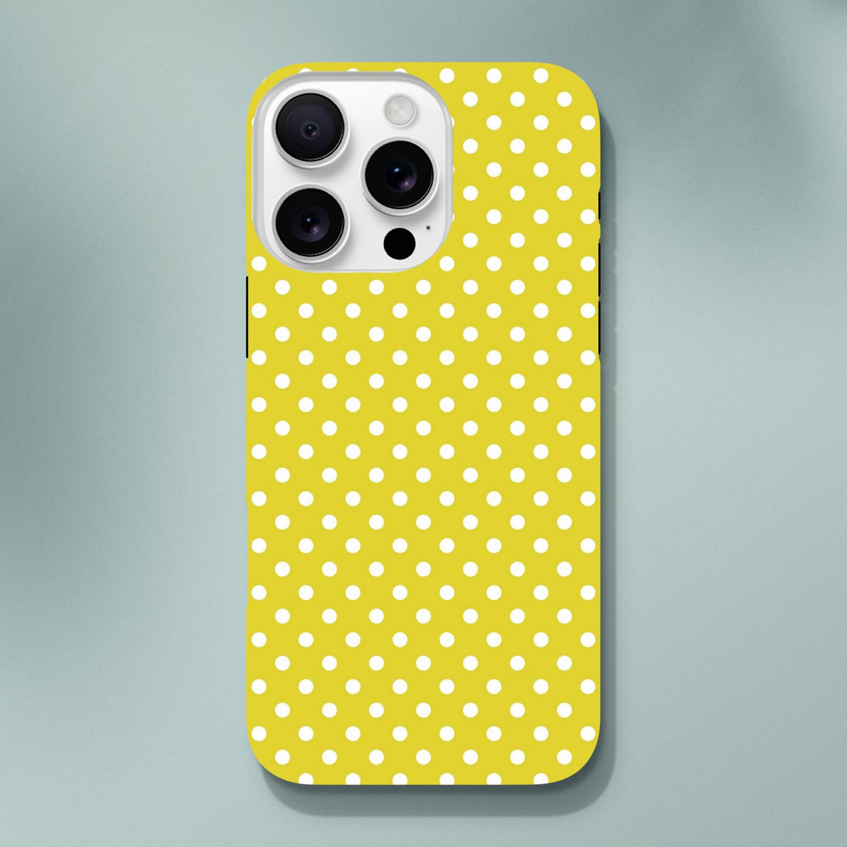 Yellow and white polka dot tough iPhone case designed for models 13-16. Cute vintage-style cover with impact-absorbing TPU protection for daily bumps.