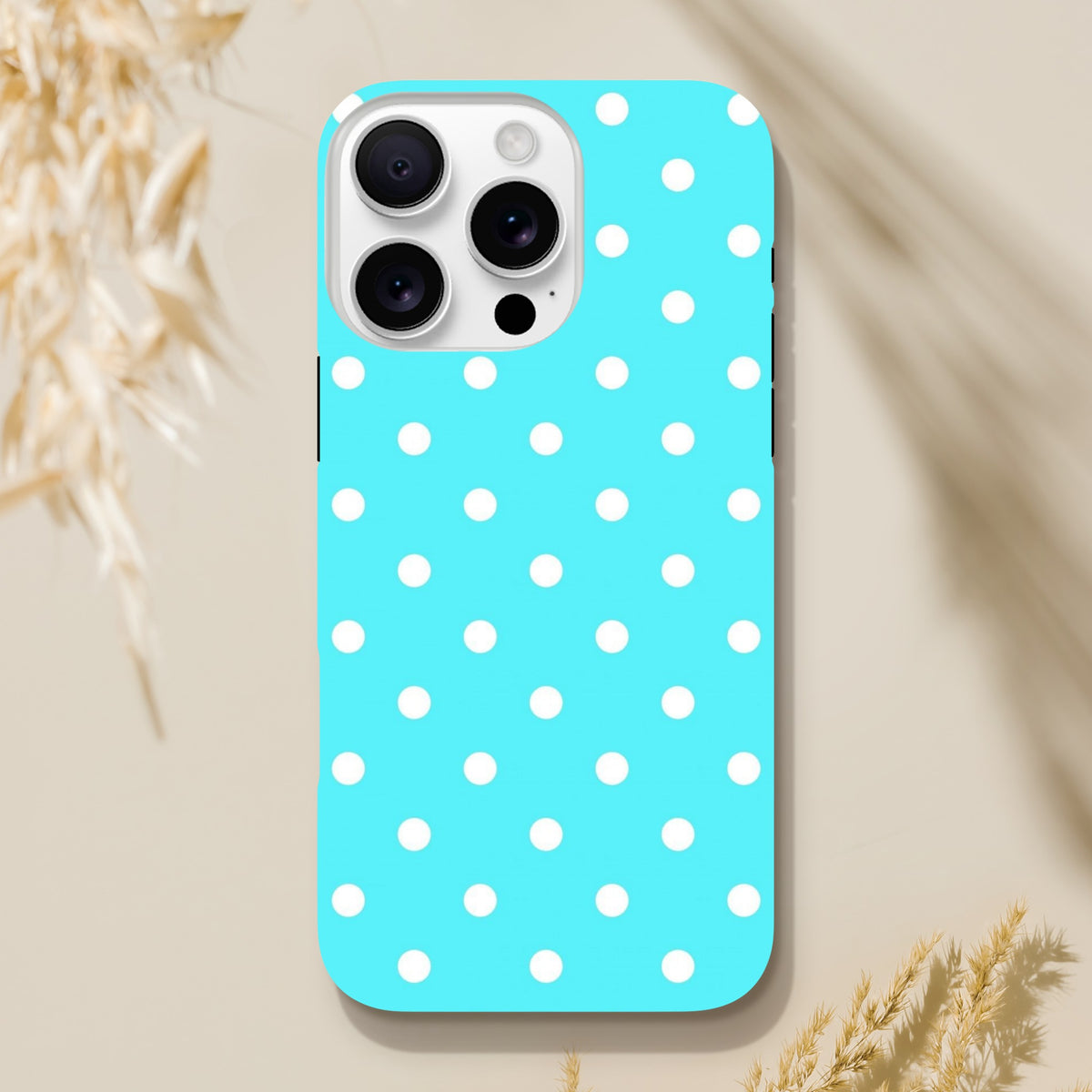 Turquoise iPhone case with white polka dots. Cute retro tough phone cover with glossy finish and drop protection for iPhone 13-16.