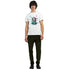 Man wearing a white Panda DJ graphic T-shirt with colorful splash art, crew-neck, short sleeves, soft cotton blend.