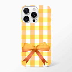 Yellow gingham iPhone case with a 3D orange ribbon bow, featuring a cute coquette checkered pattern for tough protection.