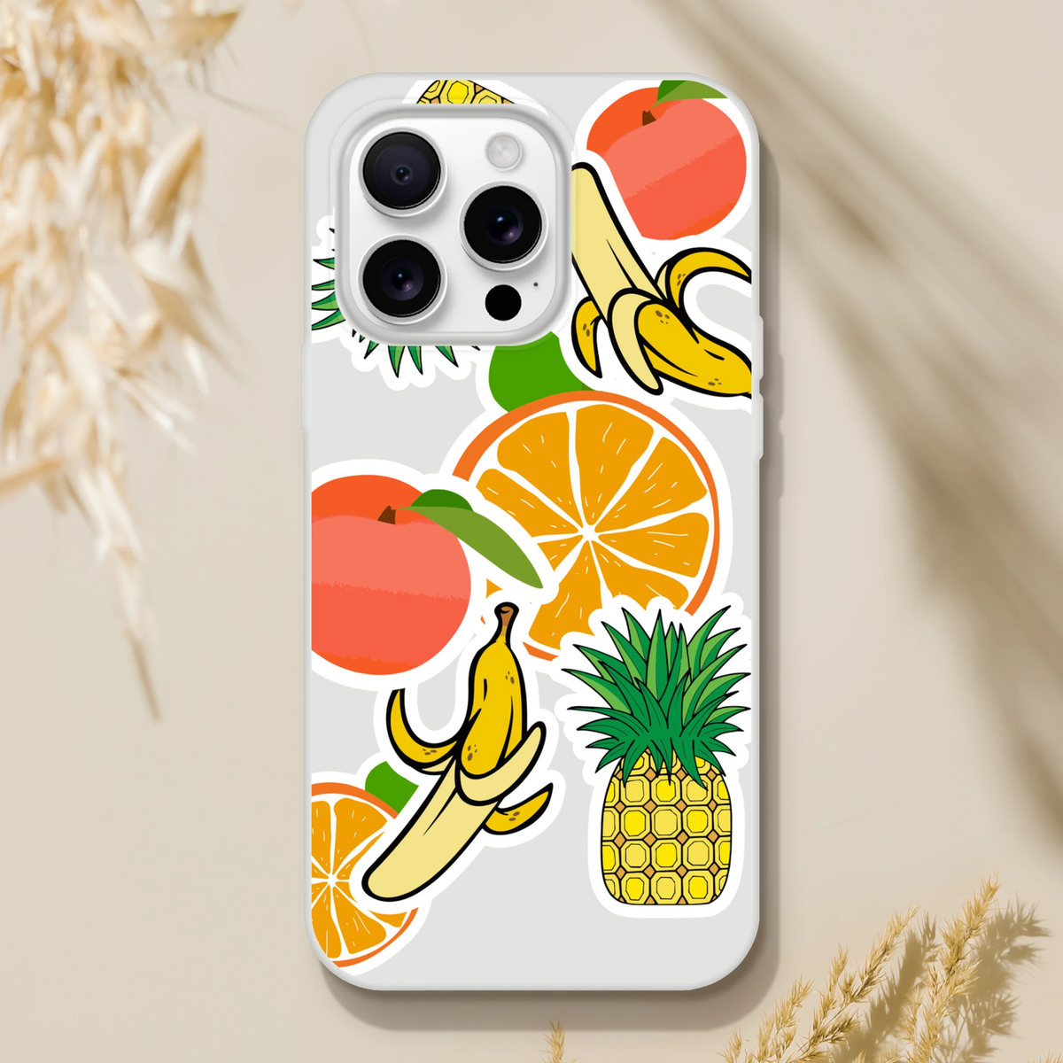 Transparent iPhone case featuring vibrant tropical fruit sticker art including orange, banana, pineapple, and peach graphics.
