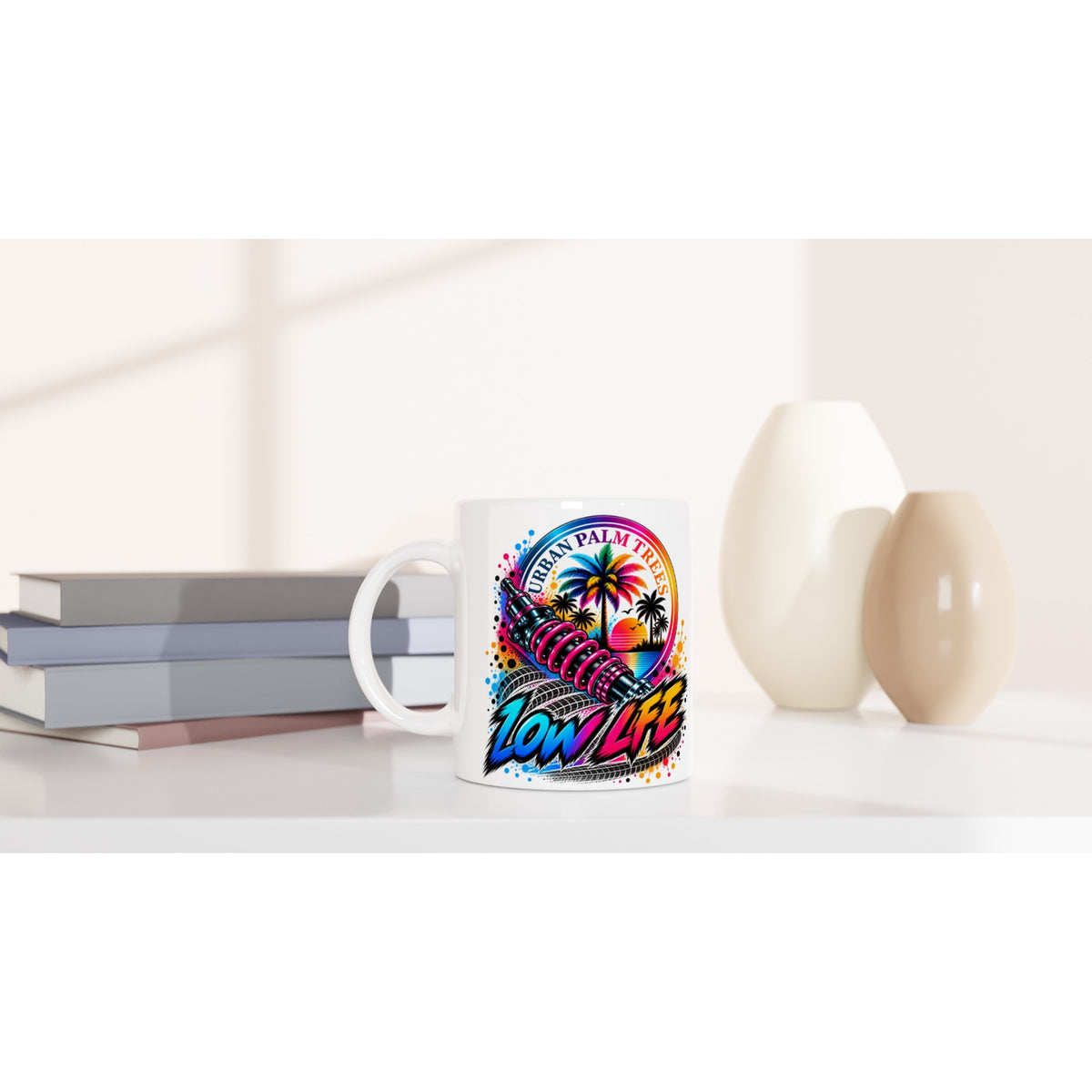 Low Life Petrolhead coffee mug featuring colorful shock absorber and palm tree sunset design for car enthusiasts.