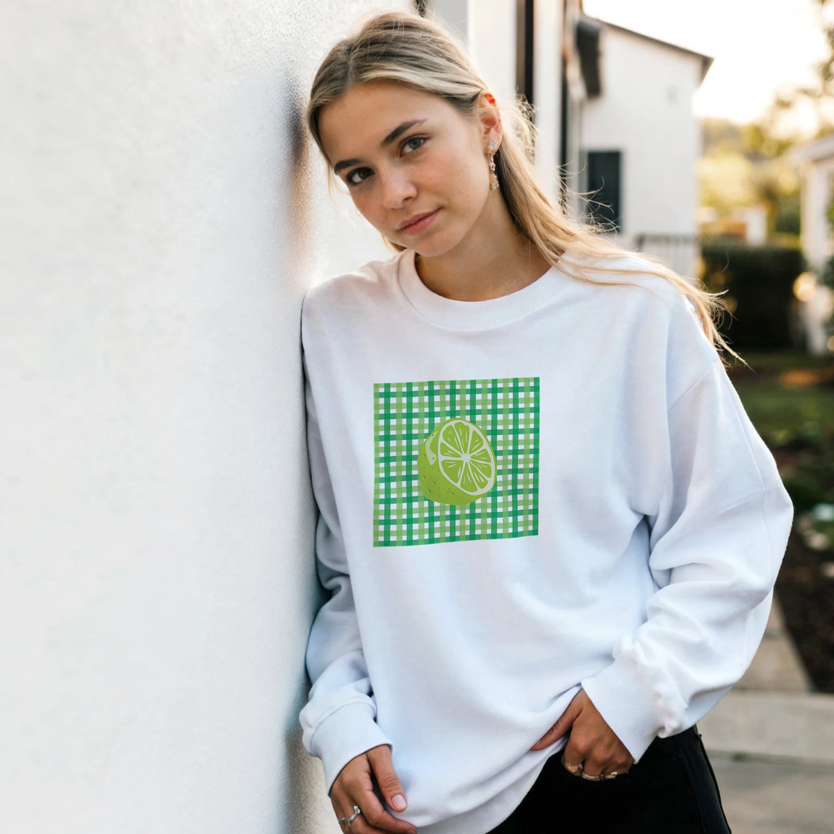 Woman wearing Retro Lime Gingham Sweatshirt for Women with a green lime graphic on a gingham panel.