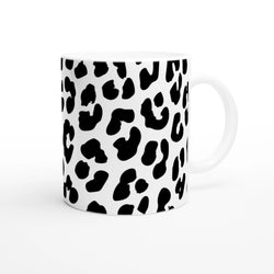 Retro Snow Leopard Mug with black leopard spots on white ceramic, animal aesthetic coffee cup.